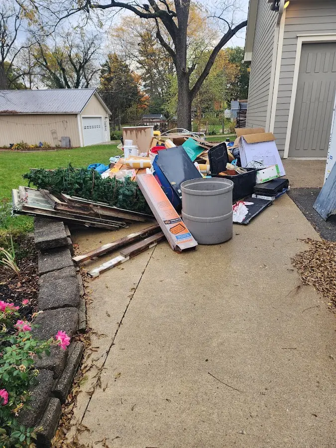 Dumpster being loaded with debris for 30 Yard Dumpster Rental in Kelly Ridge